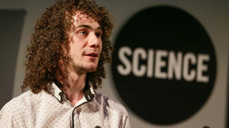 Trinity Walton Club mentor Killian Walsh, a PhD student at TCD, paying tribute to the first TWC graduates. Photograph: Sharppix