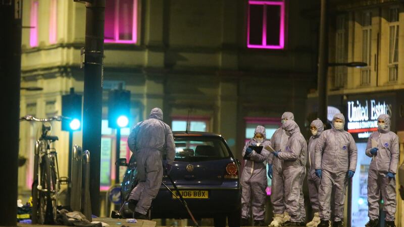 Police forensic officers work on Streatham High Road in south London on Sunday after a suspected terrorist was shot dead. Photograph: Isabel Infantes/AFP/Getty