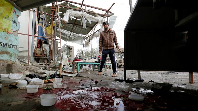 Blood stains are seen at the site of car bomb attack in a busy square at Baghdad’s sprawling Sadr City district on Monday. Photograph: Reuters
