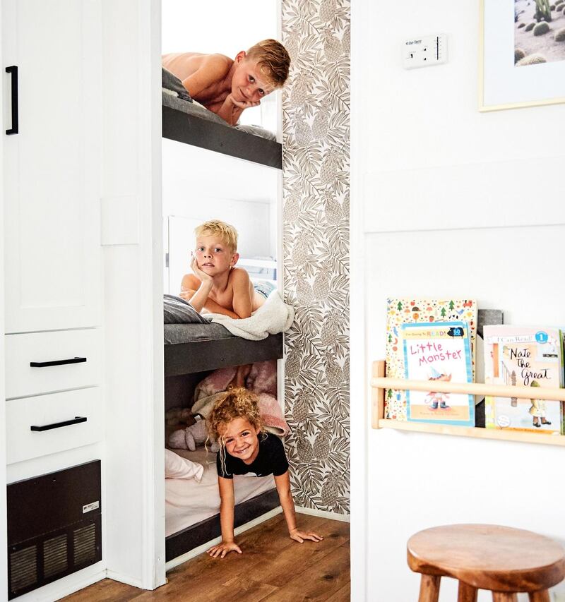 The three children of Ashley and Dino Petrone in their bunk-bed space in the couple’s 2003 Keystone Cougar trailer, which is the family home in Ventura, California. Photograph: Sian Richards