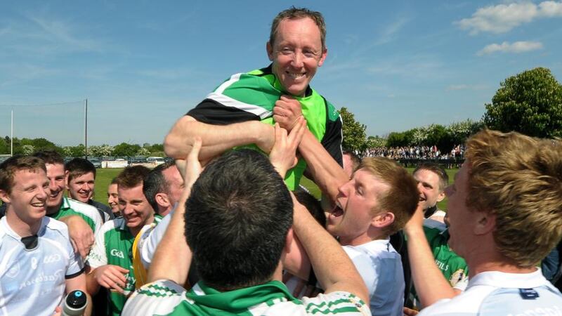 London manager Paul Coggins is carried by the jubilant team members after their famous victory. Photograph: Jim Keogh/Inpho