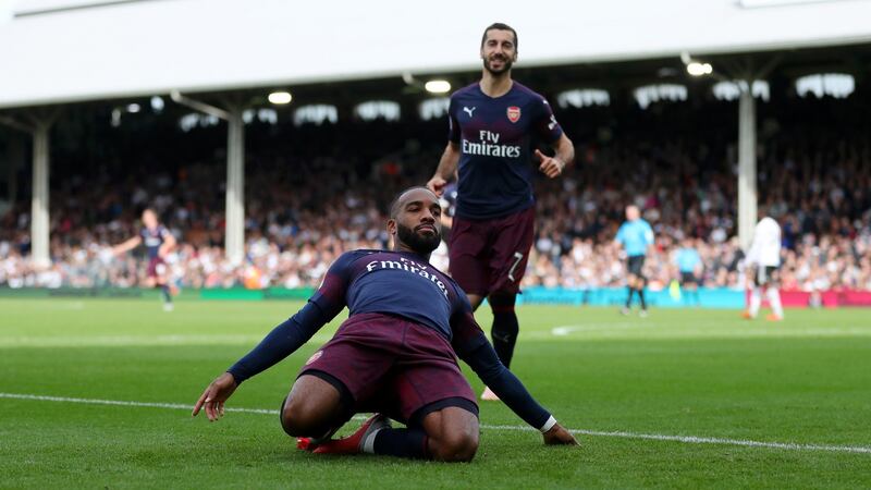 Alexandre Lacazette celebrates scoring his and Arsenal’s second at Craven Cottage. Photograph:  Catherine Ivill/Getty