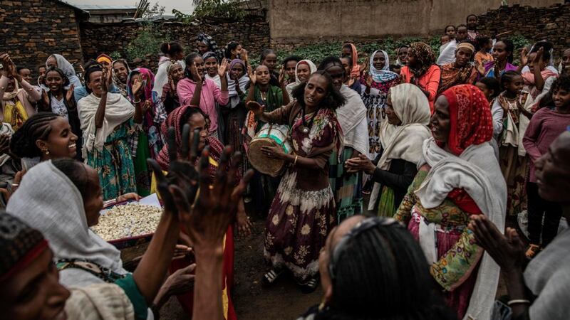 People celebrate in the town of Gijet as Tigray Defence Forces soldiers and leaders departed for Mekelle. Photograph: Finbarr O’Reilly/The New York Times