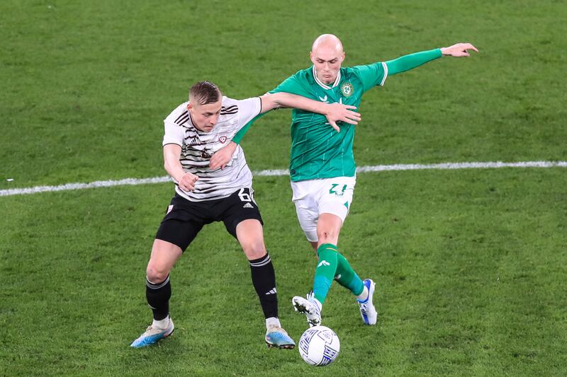 Latvia's Kristers Tobers with William Smallbone of Ireland. Photograph: Evan Treacy/Inpho