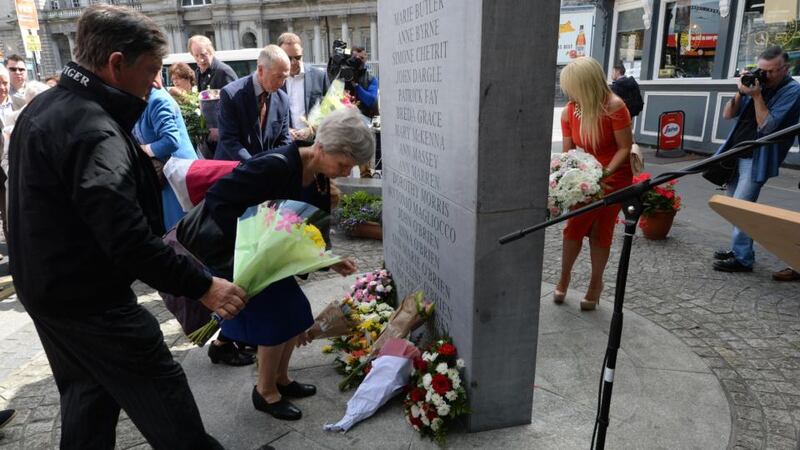 Relatives laying wreaths at the monument to commemorate the Dublin and Monaghan bomb victims on Talbot Street. Photograph: Cyril Byrne