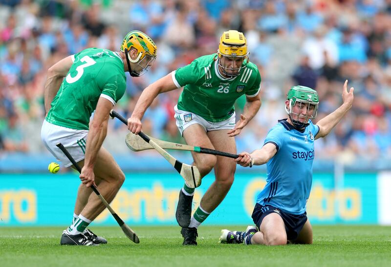 Dublin's Paddy Doyle in action against Limerick’s Dan Morrissey and Cathal O'Neill. Photograph: James Crombie/Inpho
