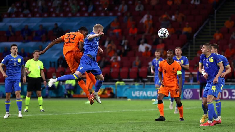 Dumfries heads in the winner. Photo: Dean Mouhtaropoulos/Getty Images