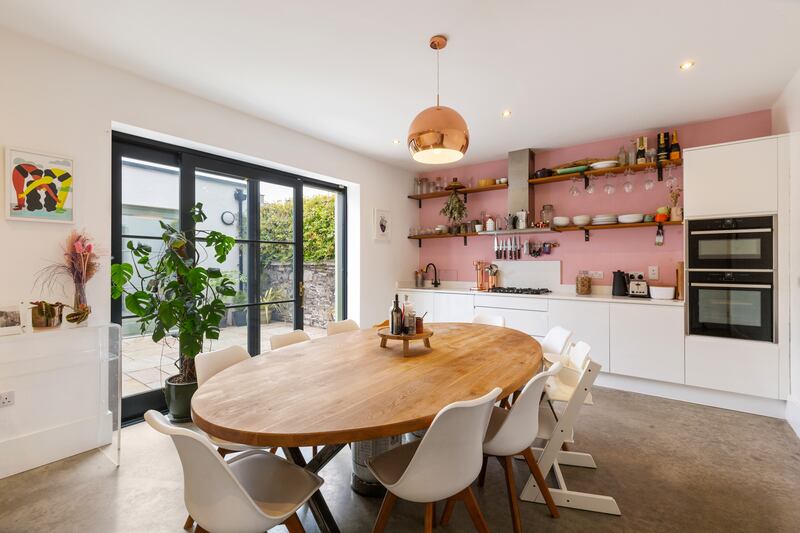 The kitchen opens out on to one of two patios. Photograph: Viv van der Holst