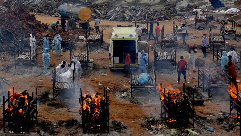 Victims of Covid-19 at a makeshift cremation ground Giddenahalli on the outskirts of Bangalore.  Photograph: Jagadeesh NV/EPA