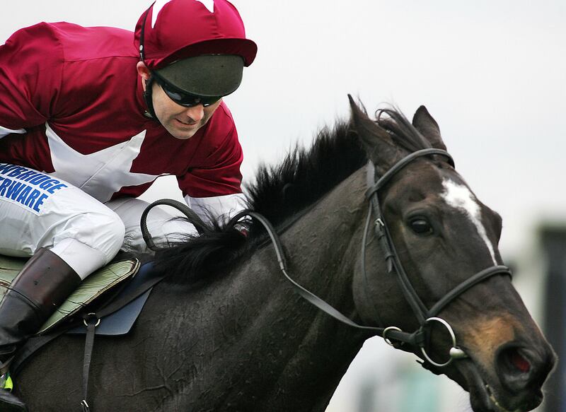 Conor O'Dwyer rides the Mouse Morris-trained War of Attrition to victory in the 2006 Gold Cup at Cheltenham. Photograph: Adrian Dennis/AFP via Getty Images
