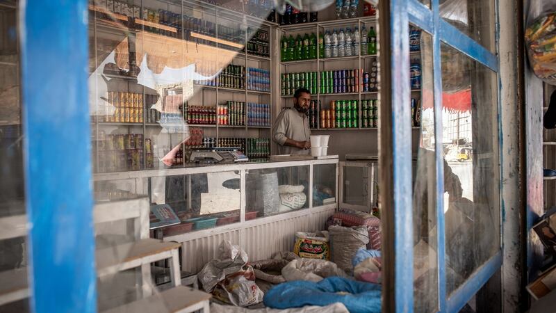 Hamidullah Hamidi in his shop near a front line in Kunduz, Afghanistan. Photograph: Jim Huylebroek/New York Times
