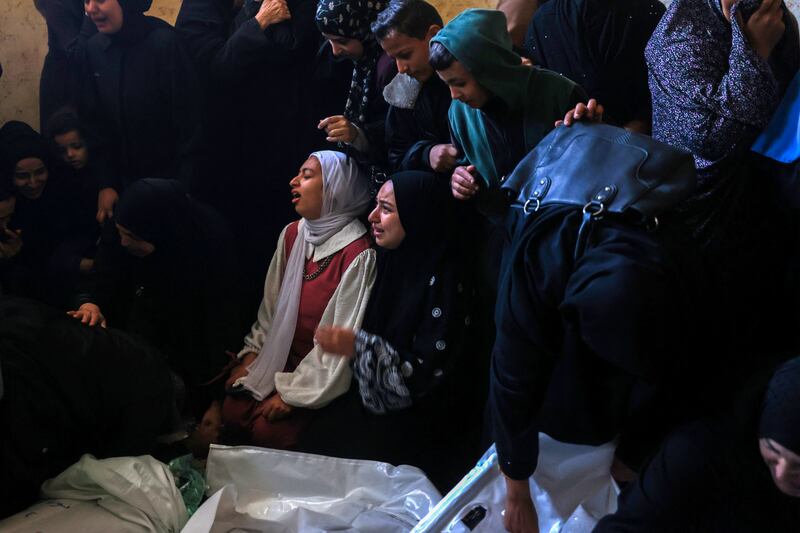 People mourn over the shrouded bodies of people killed during Israeli bombardment at al-Najjar hospital in Rafah, the southern Gaza Strip, on January 5th, 2024. Photograph: AFP/Getty 
