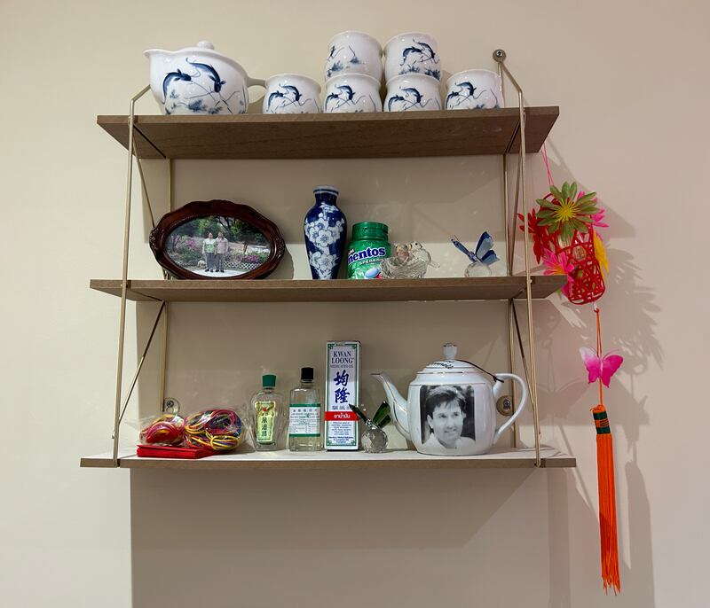A Daniel O'Donnell teapot on a shelf in the Vietnamese Community Room