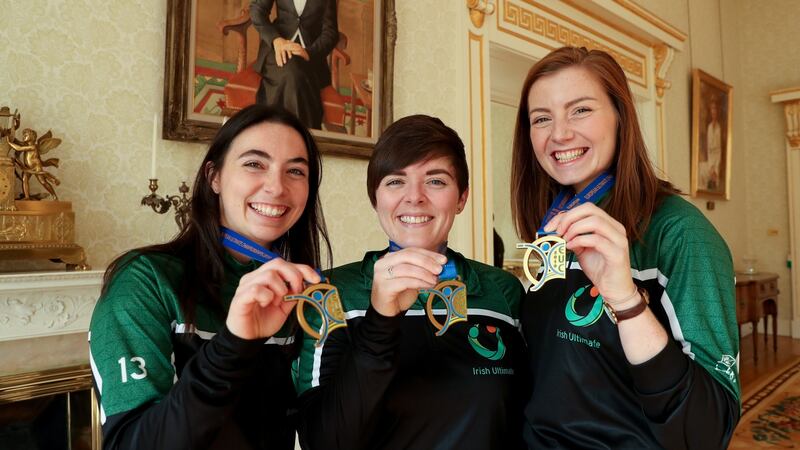 From left, Zoey Langsdale, Michelle Leahy and Grainne McCarthy, Women’s Ultimate Frisbee European Championship winners, at the Áras an Uachtaráin. Photograph: Maxwellphotography.ie