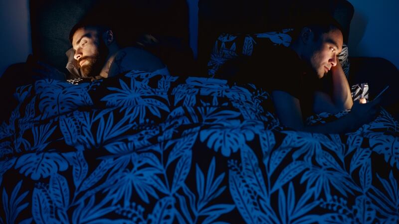 Technology can be a barrier for couples, so having a phone-free evening or banishing devices from the bedroom can help. Photograph: iStock