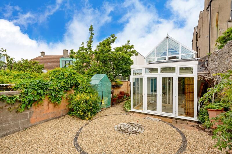 The sun room and rear garden.