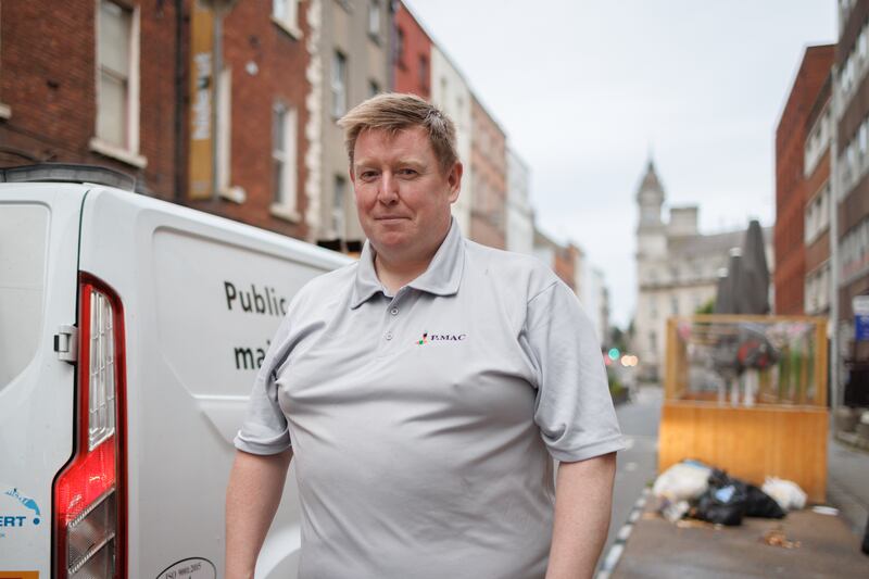 Neil Wrigley is a contractor hired by Dublin City Council to pressure wash the streets overnight and into early morning. Photograph: Dan Dennison