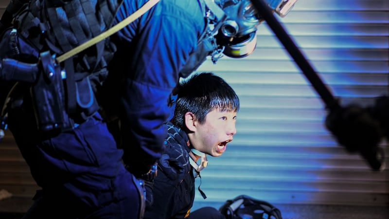 A pro-democracy protester is held by police   during a demonstration against the controversial extradition Bill in Hong Kong in August  2019. Photograph: Manan Vatsyayana/AFP via Getty Images
