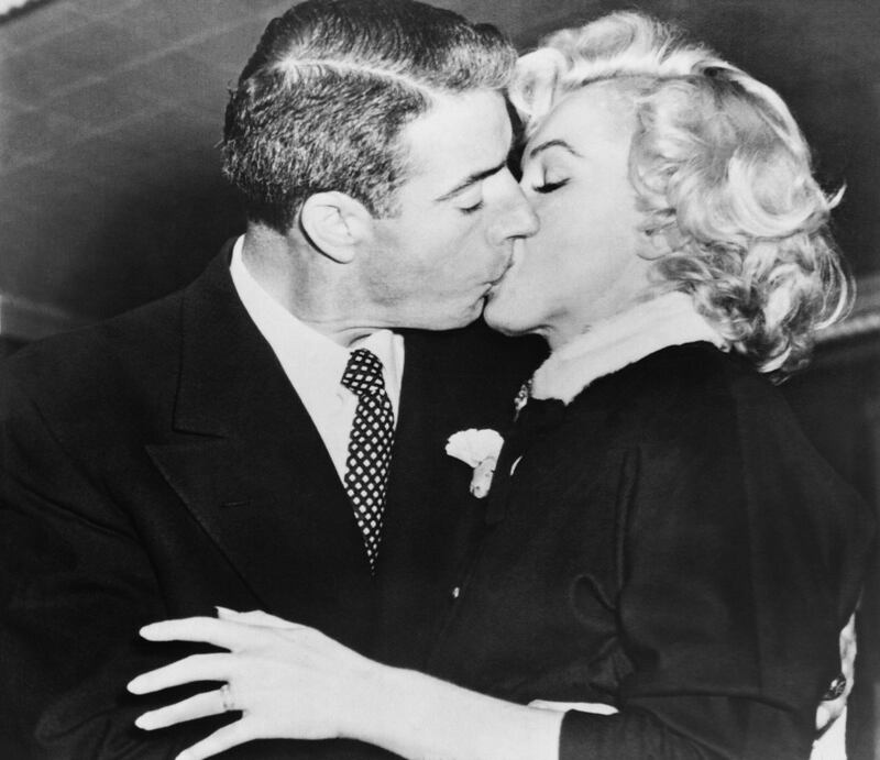 Marilyn Monroe kisses her husband, former baseball player Joe Di Maggio, on January 14th, 1954. Photograph: AFP/Getty Images