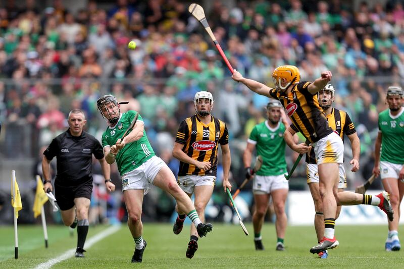 Kilkenny's Richie Reid attempts to block an effort by Limerick's Peter Casey. Photograph: Laszlo Geczo/Inpho

