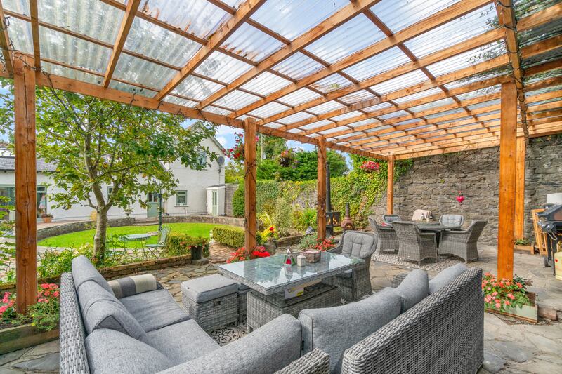 The pergola offers outside entertaining