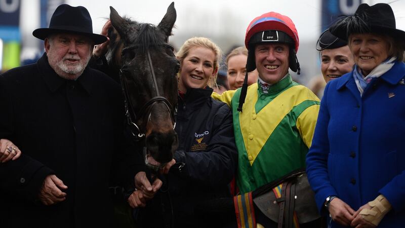 Jockey Robbie Power and trainer Jessica Harrington (right) with Sizing John after his victory in the  Gold Cup at  Cheltenham. Photograph: Harry Trump/Getty Images