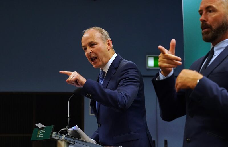 Tánaiste Micheál Martin points to protesters who disrupted his speech. Photograph: Brian Lawless/PA Wire