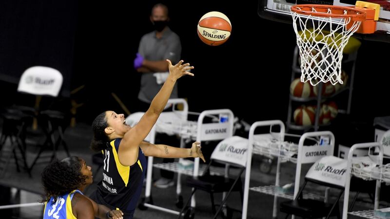 Natalie Achonwa of the Indiana Fever drives for the net as Cheyenne Parker Chicago Sky defends at Feld Entertainment Center in Palmetto, Florida on August 22nd. Photograph:  Douglas P DeFelice/Getty Images)