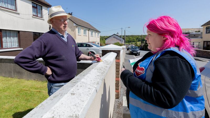 Enya Kennedy,  on the Yes campaign canvas in Castlecomer, Co Kilkenny, speaking to Seamus Dunne from Hillside View, Castlecomer. Photograph: Dylan Vaughan