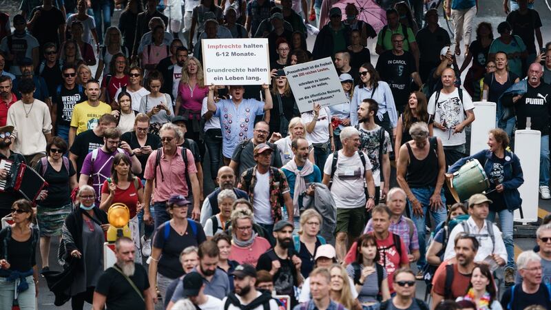Demonstrators march on the streets of Berlin, Germany, during an unauthorised protest against coronavirus measures, in Berlin. Photograph: Clemens Bilan/EPA