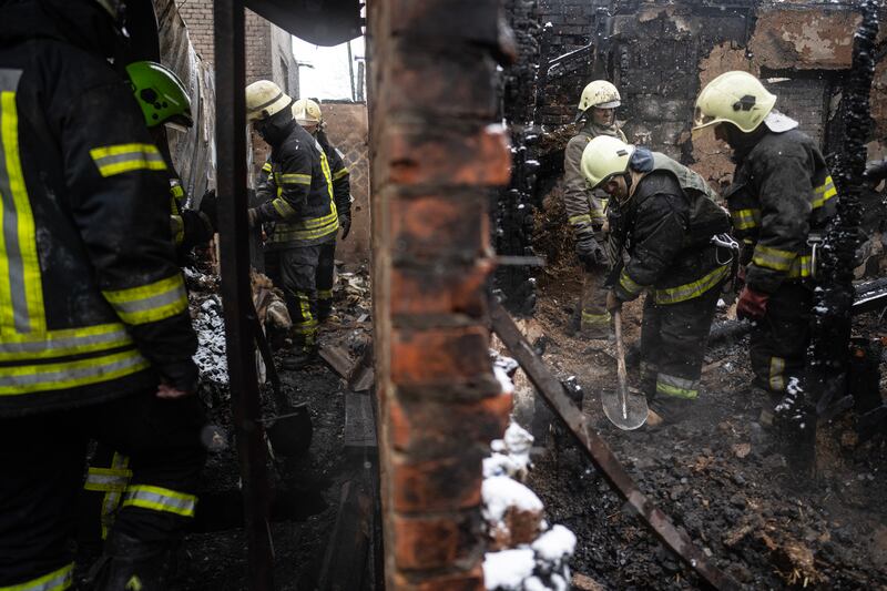 Ukrainian emergency workers search through rubble for the body of a missing child after at least seven people were killed when Russian drones struck a fuel depot in Kharkiv on Febraury 10th, 2024. Photograph: Lynsey Addario/The New York Times