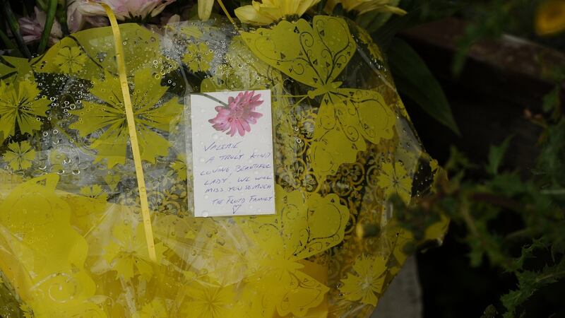 A floral tribute  left at the entrance to the house in Kilbree, where a  mother of three was discovered murdered on Friday. Photograph:  Conor McKeown