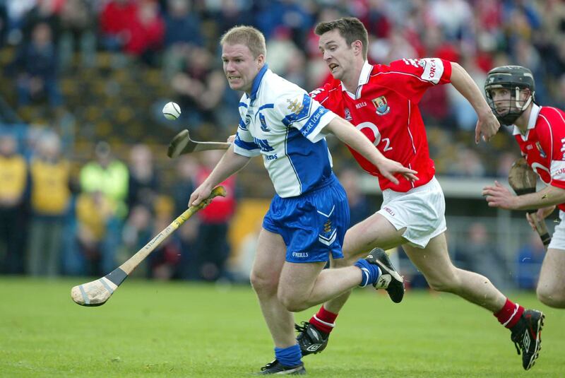 Brian Flannery of Waterford gets away from Alan Cummins of Cork during the 2002 Munster SHC semi-final. Photograph: Billy Stickland/Inpho