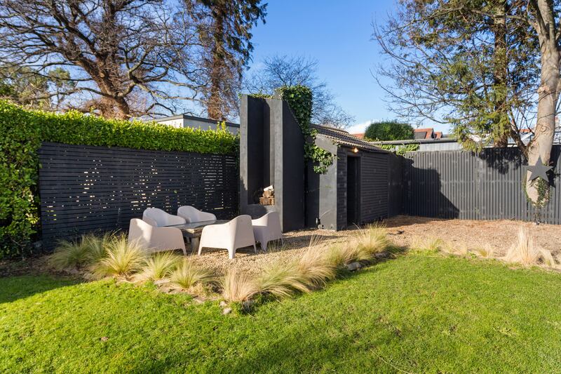 Gravelled seating area, with tall open chimney