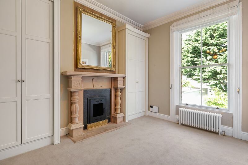 Bedroom with en suite and sandstone fireplace