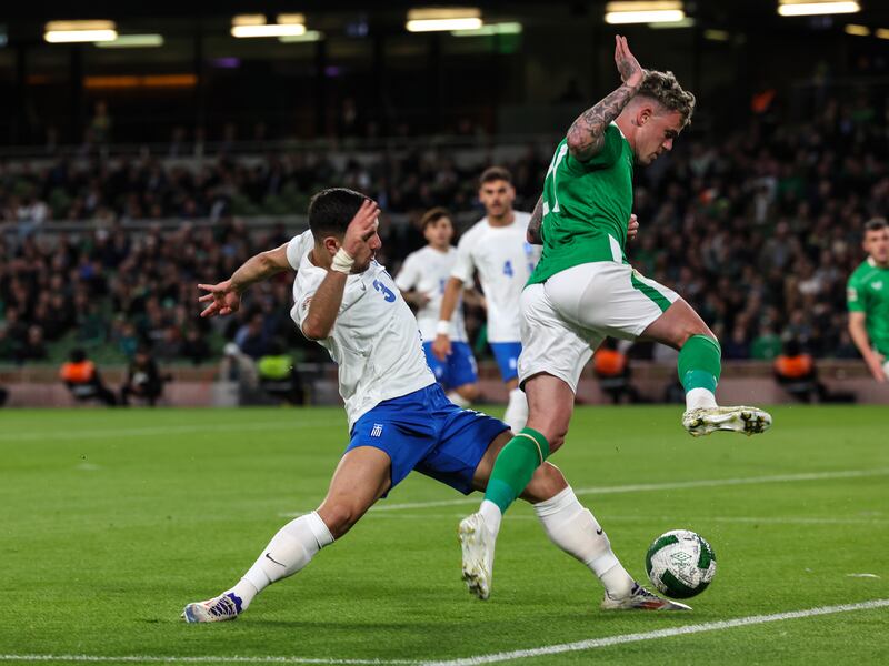 Greece's Konstantinos Koulierakis challenges Ireland's Sammie Szmodics  at the Aviva Stadium. Photograph: Morgan Treacy/Inpho