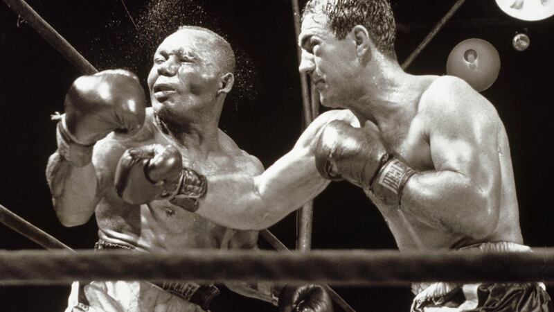 Mayweather is looking to beat Rocky Marciano’s record of 49 fights and 49 wins. Marciano is pictured knocking out Jersey Joe Walcott in 1952. Photo: Getty Images