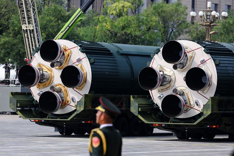 Armoured vehicles carrying the DF-5C liquid-fueled intercontinental strategic nuclear missiles. Photograph: EPA