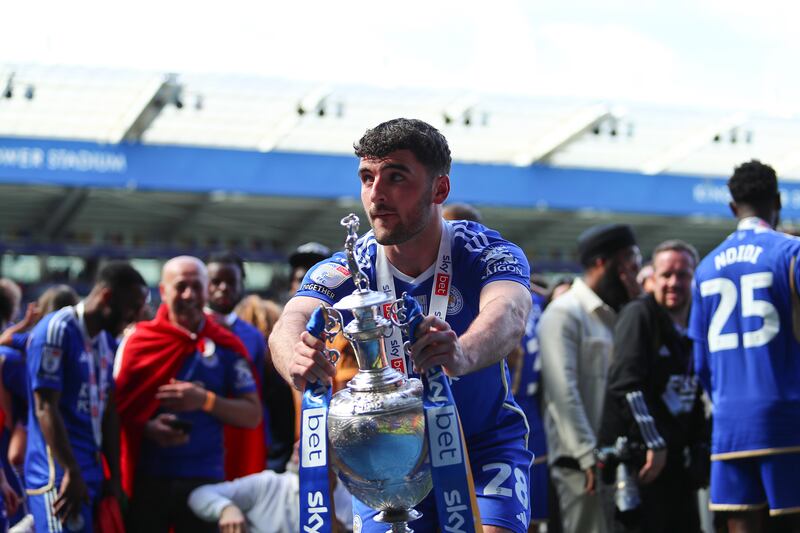 Tom Cannon of Leicester City celebrates with the Championship trophy after their win against Blackburn Rovers at King Power Stadium on May 4th. Photograph: Copa/Getty Images