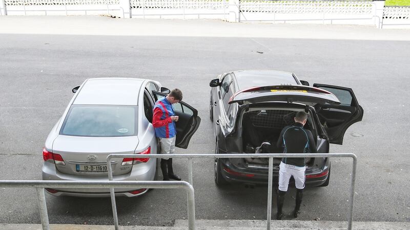 Jockeys prepare for racing out of their cars. Photo: Bryan Keane/Inpho