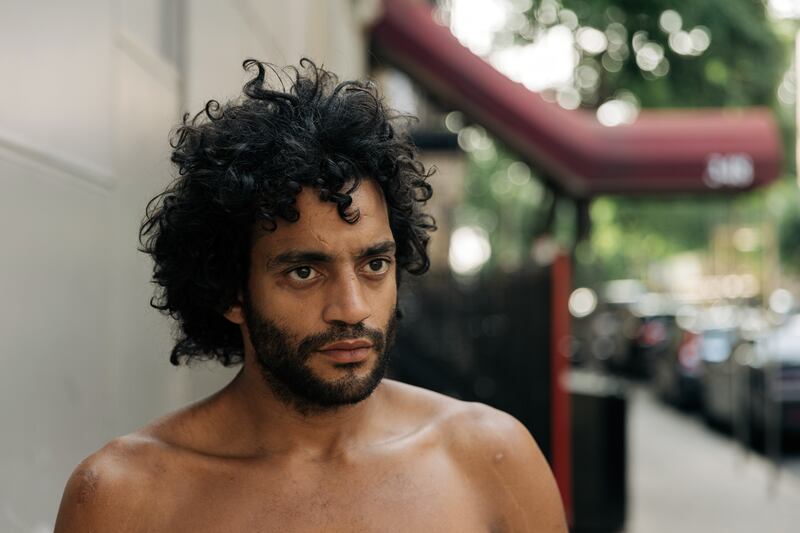 JC Lopez, who survived a stabbing on East 14th Street, in Manhattan. After a brief hospital stay, he returned to the block. Photograph: Jeenah Moon/The New York Times