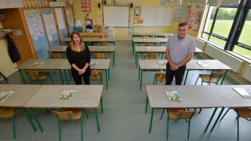 Monica Hickey, 5th class teacher, and Matt Melvin, school principal, at St Etchen’s National School, Kinnegad, Co Westmeath in a classroom that can now accommodate 20 pupils according to the HSE guidelines on social distancing in schools. Photograph: Alan Betson