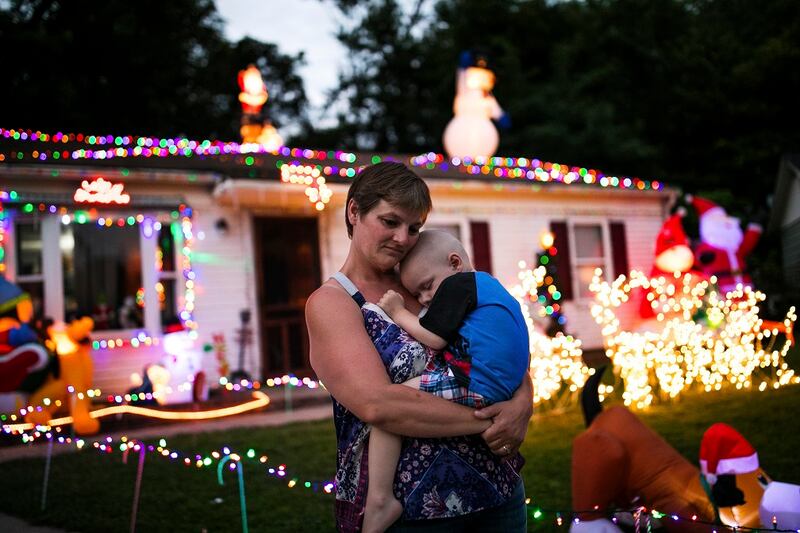 Shilo Allen holding her son Brody outside their home in the suburbs of Cincinnati.