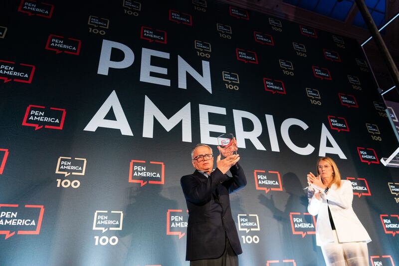 Taghi Rahmani accepts the Barbey Freedom to Write Award on behalf of his wife, Narges Mohammadi, who is imprisoned in Iran, at the PEN America Literary Gala in New York. She is serving a 10-year jail sentence in Tehran’s notorious Evin prison. Photograph: Jutharat Pinyodoonyachet/The New York Times
                      