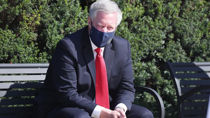 White House chief of staff Mark Meadows sits on a bench nearby as  Sean P Conley, physician to the president, gives an update on the condition of US president Donald  Trump at the Walter Reed National Military Medical Center in Bethesda, Maryland, on Sunday. Photograph: Michael Reynolds/EPA