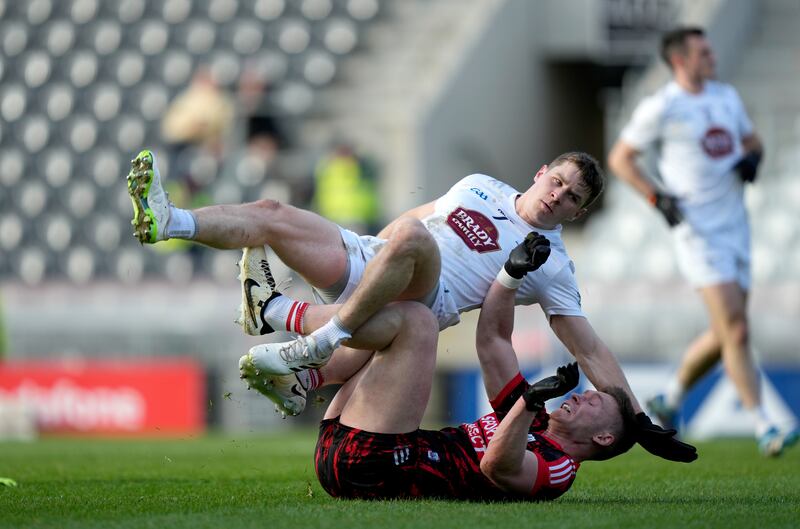Kevin Flahive of Cork and Jack Sargent of Kildare tussles at SuperValu Páirc Uí Chaoimh on Sunday. Photograph: James Lawlor/Inpho