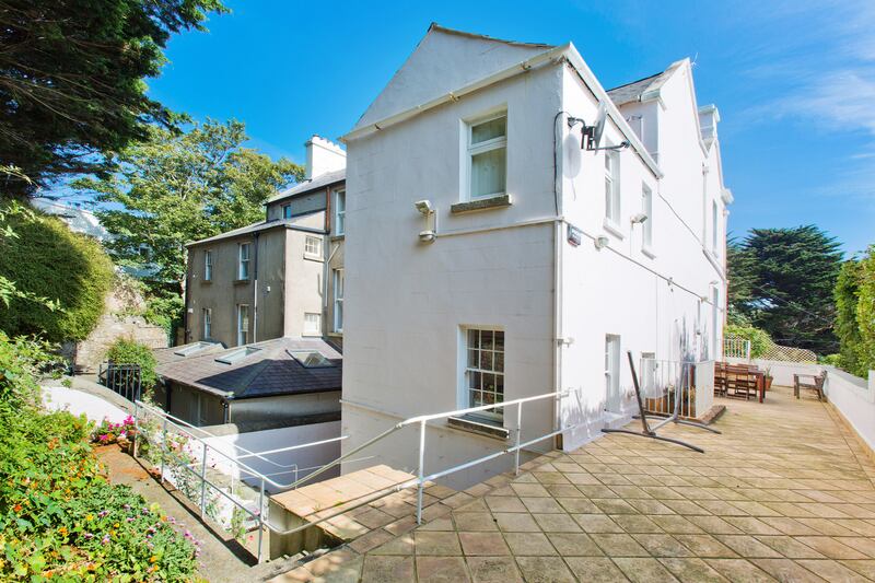 Rear view of the house and outdoor patio area.