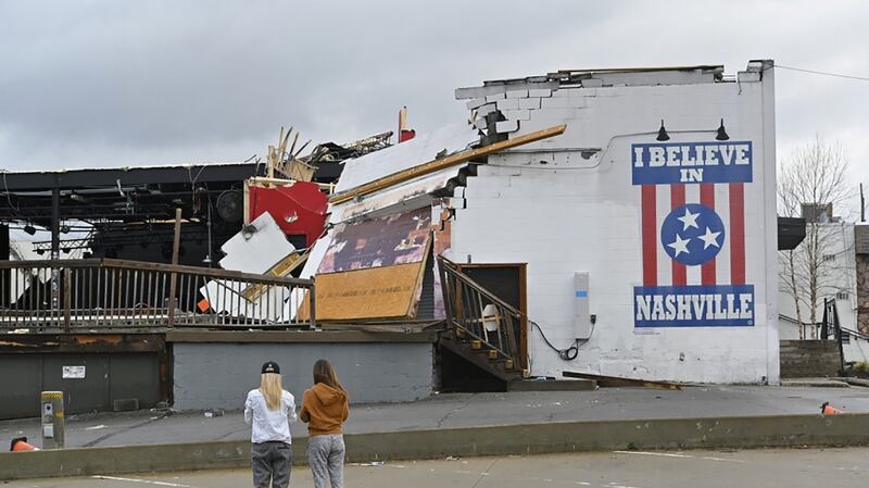 Women view damage at the Basement East music venue after a tornado touched down in Nashville, Tennessee, US. Photograph: Harrison McClary/Reuters