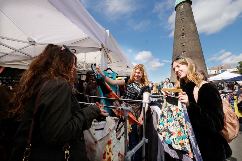 Visitors to the Fussy Galore (aka Nuala Reddy) stall at the We Love Markets at the Digital Hub in the Liberties. She specialises in vintage clothes from the 1940s up to the 1990s. Photograph: Alan Betson
