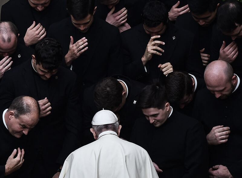 2020. Pope Francis prays with priests at the end of a limited public audience at the San Damaso courtyard in The Vatican on September 30, 2020. Photograph: Filippo Monteforte / AFP via Getty Images      
